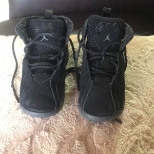 Black air Jordan’s size 9c. Suede like material.